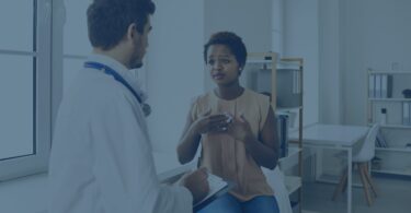 Woman speaking with health care provider
